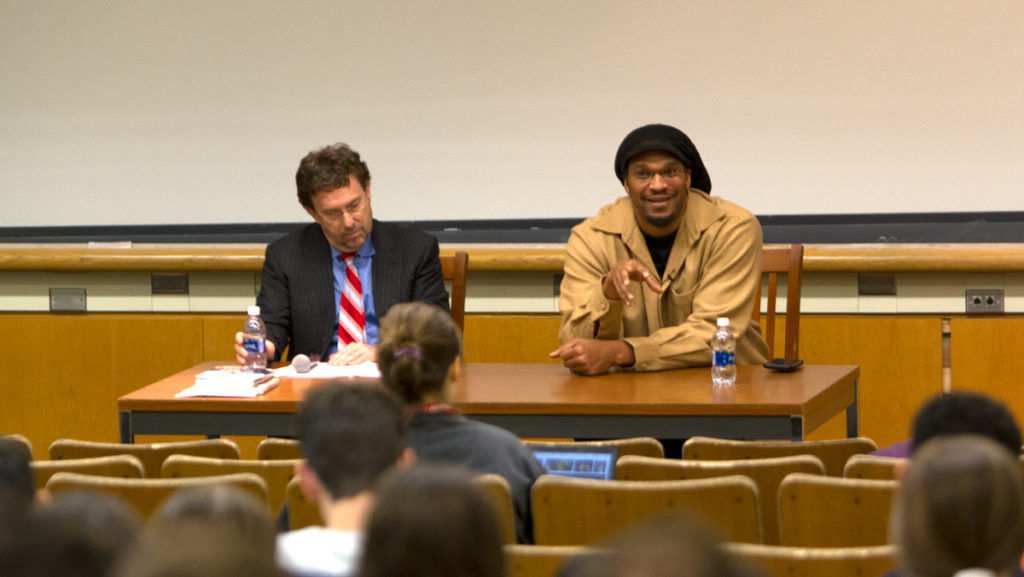 From left, Cornell history professor Larry Glickman sits next to former NBA player Etan Thomas. Thomas spoke at Cornell University about athletes involved in political activism on Feb. 27.