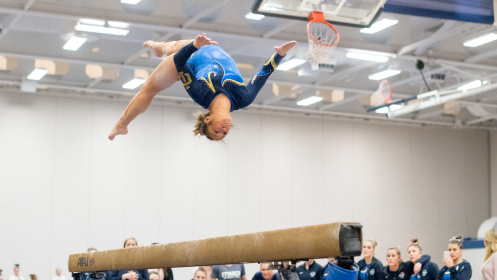 Sophomore Emily Szembrot competes on the balance beam at the Rumble and Tumble meet on Feb. 14.