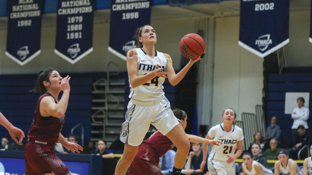 Julie Yacovoni, senior forward and guard for the Ithaca College women’s basketball team, goes up for a layup against Ariella Rosenthal, senior guard from Vassar College on Feb.17.