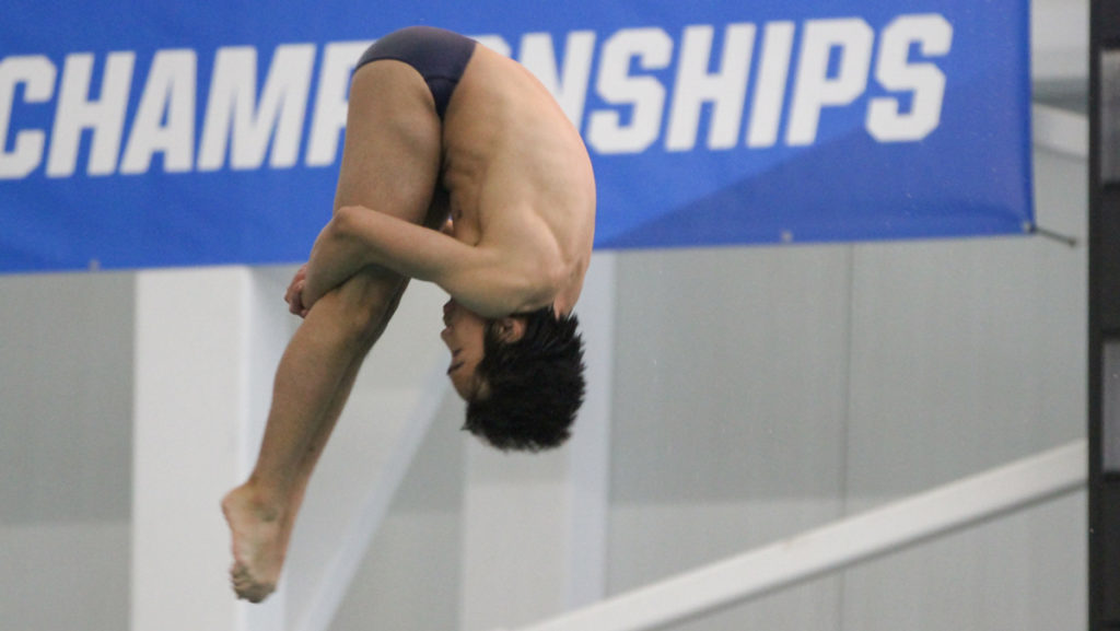 Freshman diver Justin Moczynski competes in the 1-meter dive Feb. 10. Moczynski is the only Bomber diver to qualify for the NCAA Regionals.