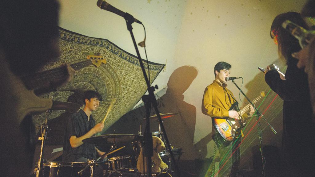  From left, juniors Caleb Matheson and Sam Stein, members of the trio Lazy Bones– also including junior Brendan Olivieri on bass, guitar, synth and vocals–performed at Varsity Sex Club on Feb. 2. Three other bands performed at the concert venue.