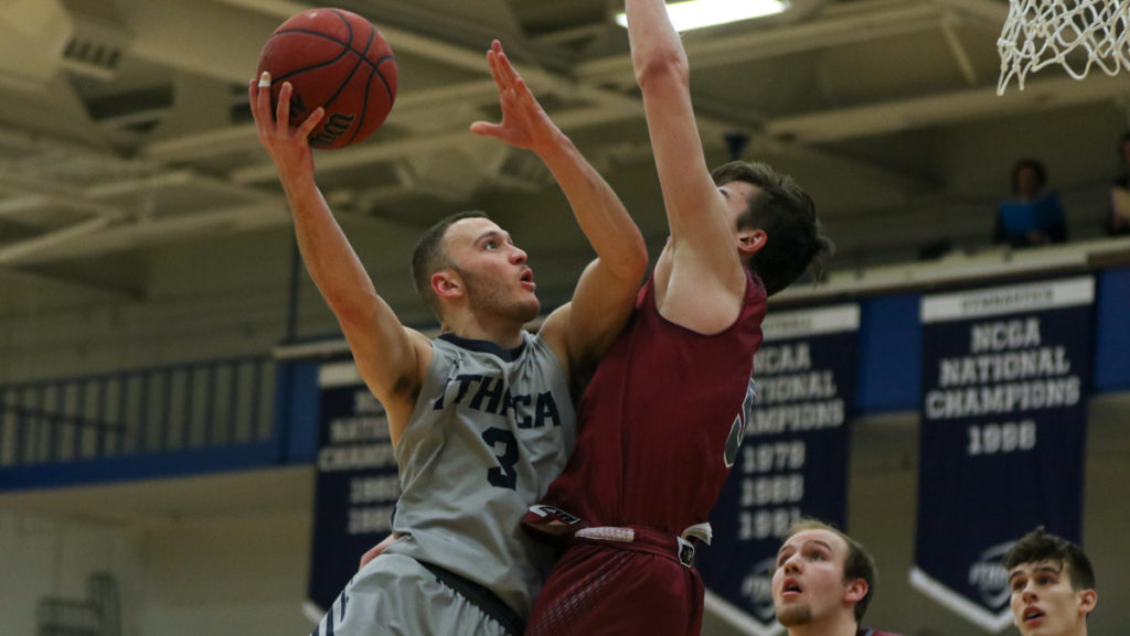 Senior guard Marc Chasin looks to score over Owen Murray, sophomore guard from Vassar College. The Bombers lost to Vassar 66–54.
