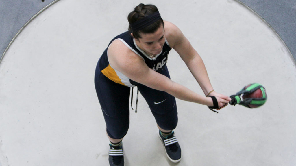 Freshman thrower Samantha Healy competes in the 20-lbs weight throw during the Home Tri with SUNY Cortland and Utica College on Feb. 16.