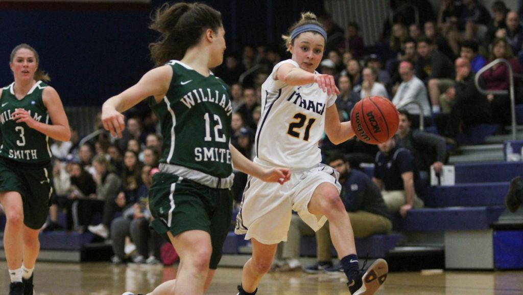 Junior guard Meghan Mazzella drives to the basket against William Smith freshman guard Angela Bussone during the Bombers 80–63 win over the Herons.