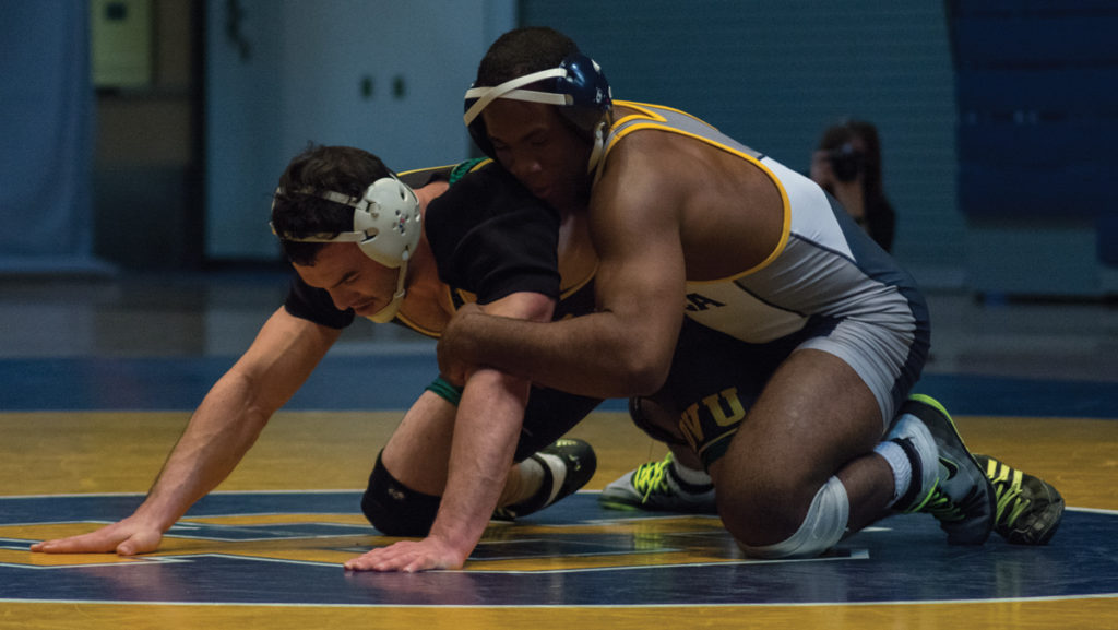 Wrestler Jaison White competes for the Bombers in Ben Light Gymnasium.