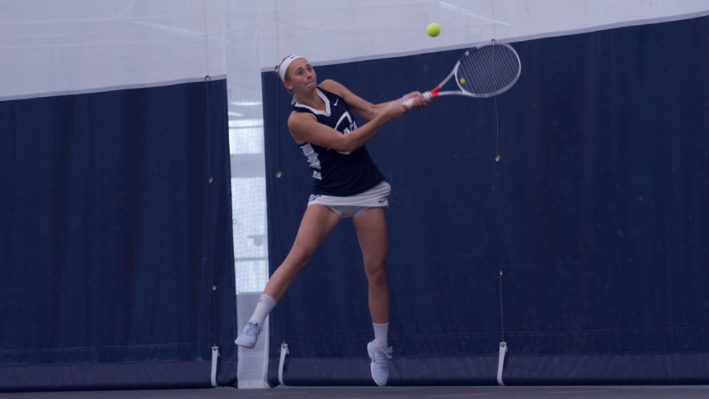 Junior Caroline Dunn hits the ball during the match against Skidmore College on March 24.