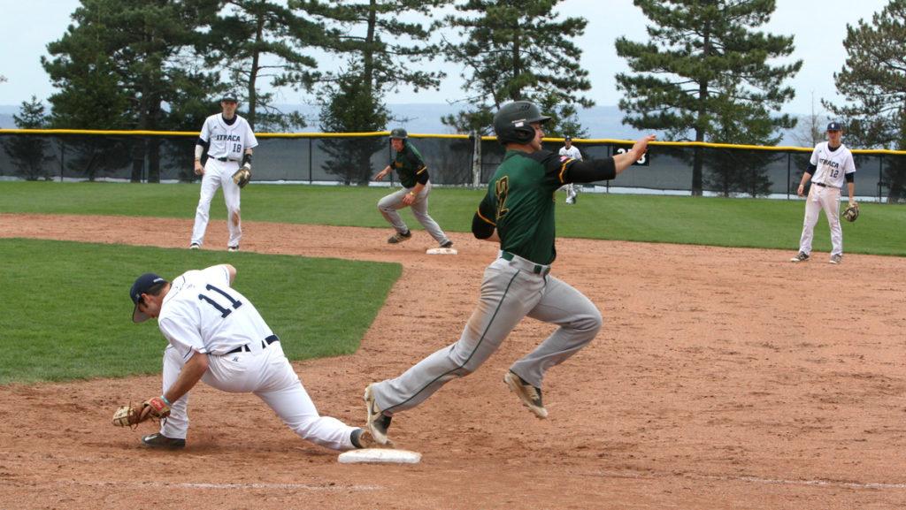 Junior first baseman Andrew Bailey gets the out against senior outfielder Drew Delasiis on April 28 at Freeman Field.