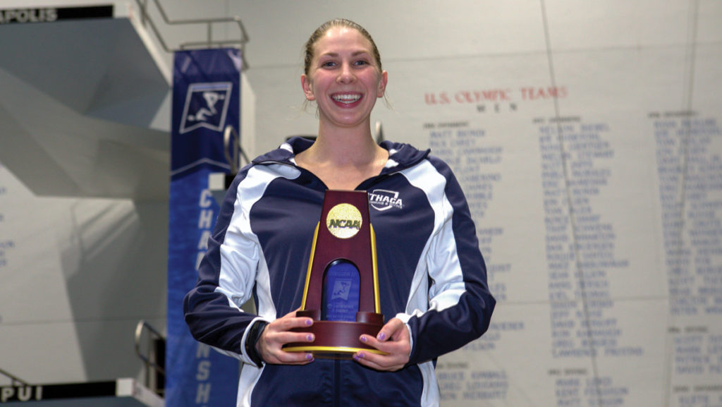 Griesemer stands with her trophy after winning a national championship. She took home the 1- and 3-meter titles at the NCAA Divison III Diving Championships.