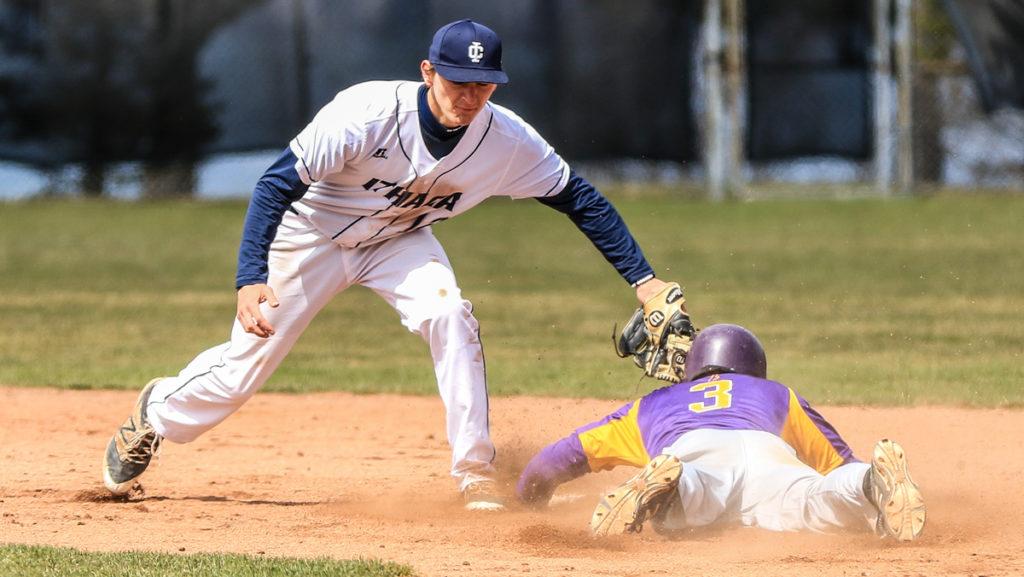 Freshman shortstop Jack Lynch tags Dennis Rudolph, Elmira College senior outfielder, out at second during the Bombers 5–3 victory April 8.