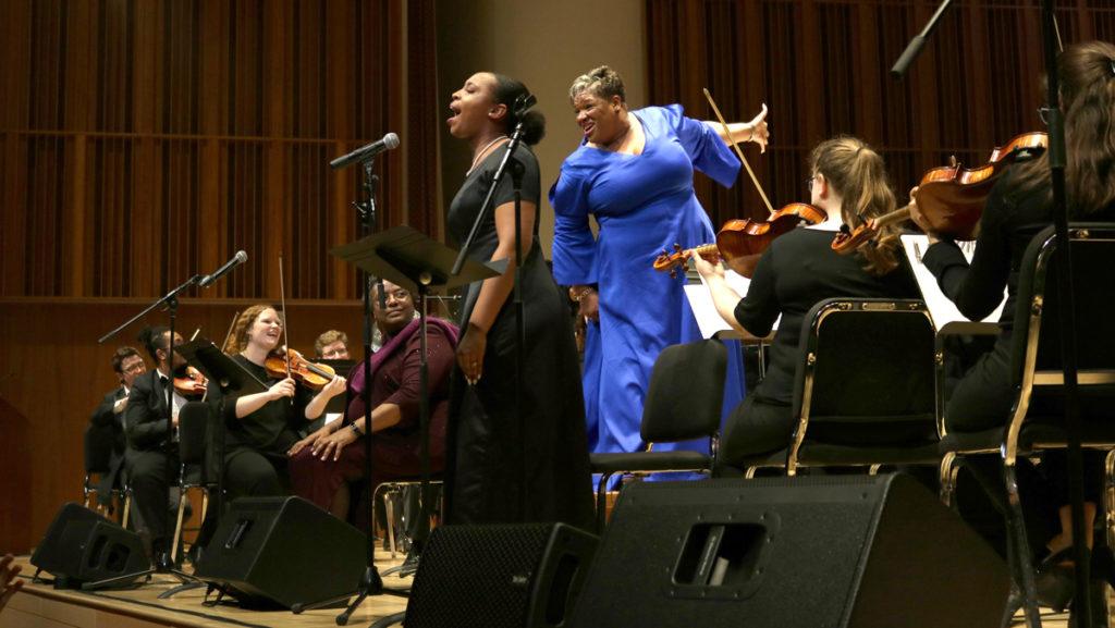 Nia Gaines, left, and Bishop Chantal R. Wright, right, performed at the Ithaca College Gospel Music Festival with the Songs of Solomon Academy. Wright was invited to conduct the groups of students that sang during the festival. 