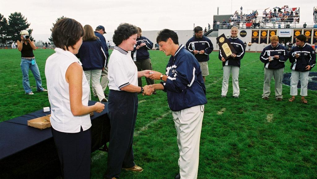 Pallozzi accepts her national championship ring Sept. 22, 2002, from former Ithaca College President Peggy Ryan Williams.