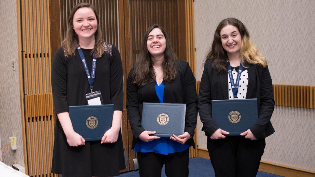 From left, senior Brittany Giles, sophomore Lauren Suna and senior Sam Castonguay hold the awards they received at the 21st Annual James J. Whalen Academic Symposium held in Campus Center on April 12