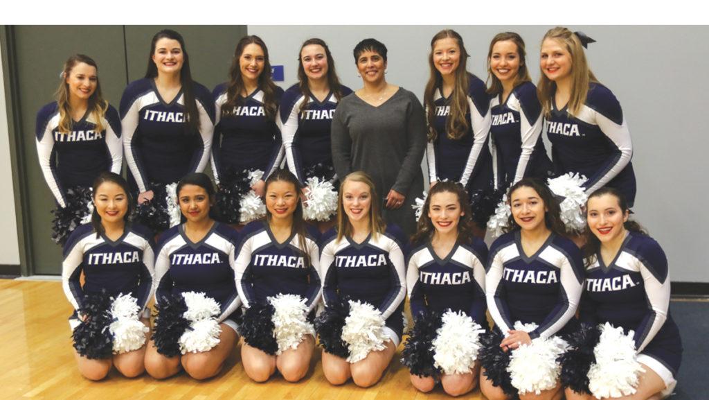 The Ithaca College club cheerleading team poses with Ithaca College President Shirley M. Collado at the womens basketball game Feb. 10.