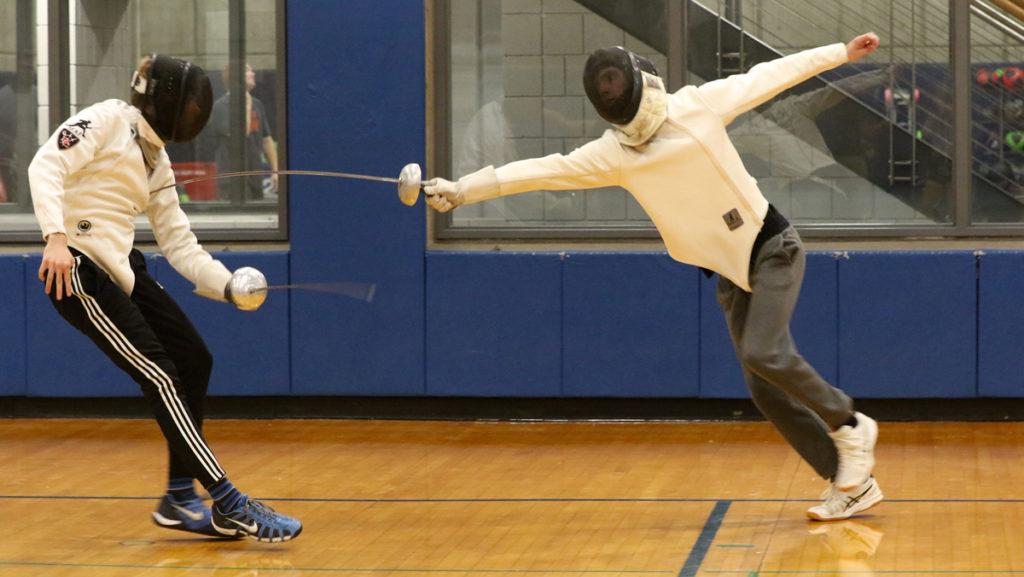 Sophomore Ben Cafaro, president of the Ithaca College Club Fencing team, bouts with freshman Alex Kite at practice Sept. 20.