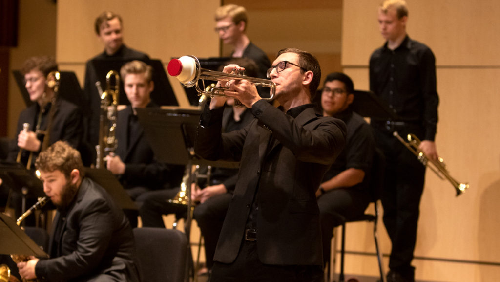 Junior Jason Springer plays the trumpet at the Ithaca College Jazz Ensemble’s  children’s concert Sept. 15. The concert was held in Ford Hall. Michael Titlebaum,  associate professor in the Department of Music Performance, directs the ensemble.