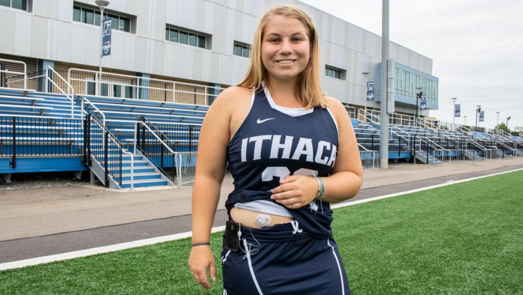 Freshman Kyra Feick shows her insulin pump. Feick was diagnosed with Type 1 Diabetes when she was 7 years old and is able to constantly check her blood sugar levels while at practice.