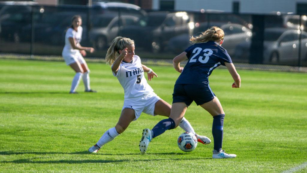 Sophomore midfielder and forward Alex Epifani tries to defend against Jessica Egan, junior defender from Wilkes University, at Carp Wood Field on Sept. 5.