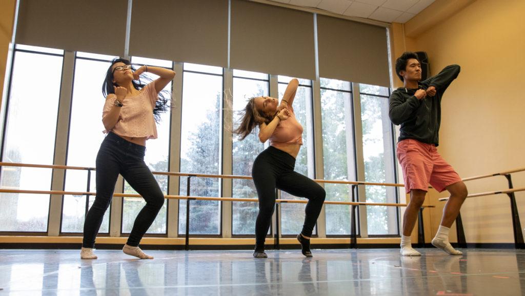From left, junior Angelee Chen, sophomore Julia Cohen and graduate student James Yoon dance at rehearsal for K-pop dance group Katalyst.
