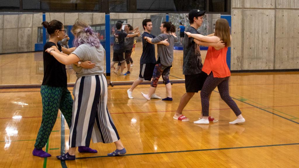 Members of IC Ballroom practice their dance routines in the Wood Floor Gym in the Fitness Center.