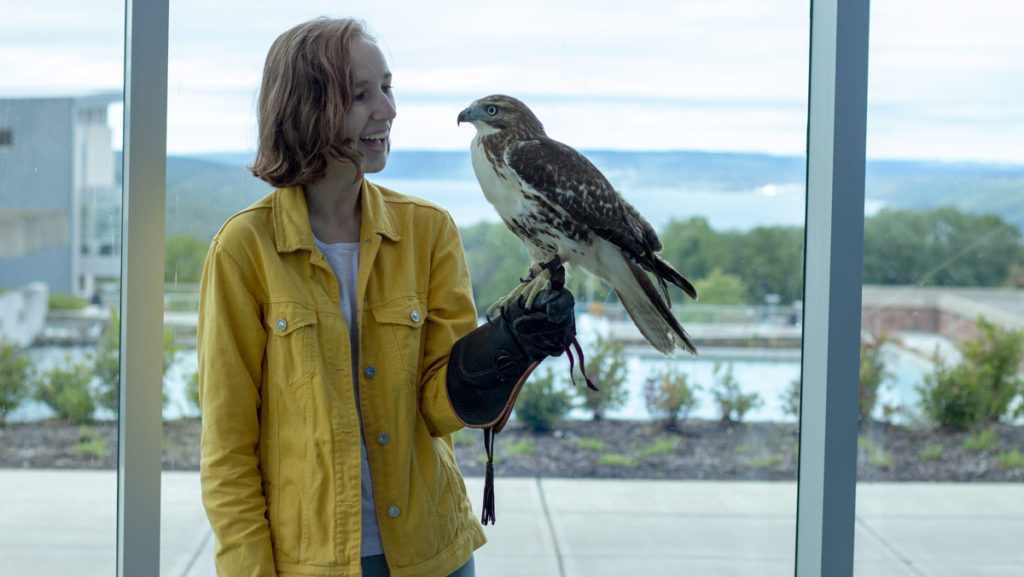 Freshman Ana Maria Arroyo is an amateur falconer, and occasionally brings a juvenile red-tailed hawk named Gracie to campus to train during the day. Arroyo recently founded a new student club to connect students at the college with local wildlife. 