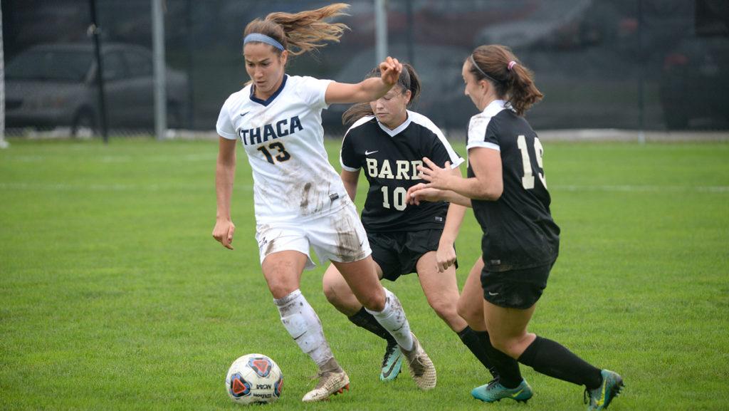 Junior midfielder Gabriella Mihale dribbles the ball past two Bard College defenders during the game Oct. 6.