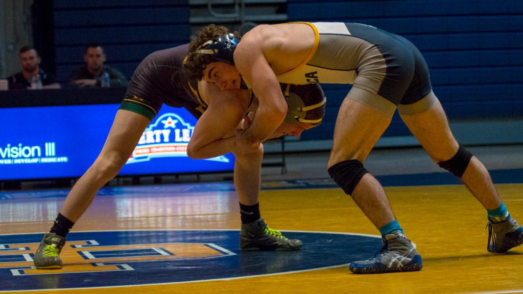 Then-junior Ferdinand Mase wrestles Kordell Rush, then-junior from Delaware Valley  University on Jan. 27. Mase’s overall record wrestling for the Blue and Gold is 91–37.