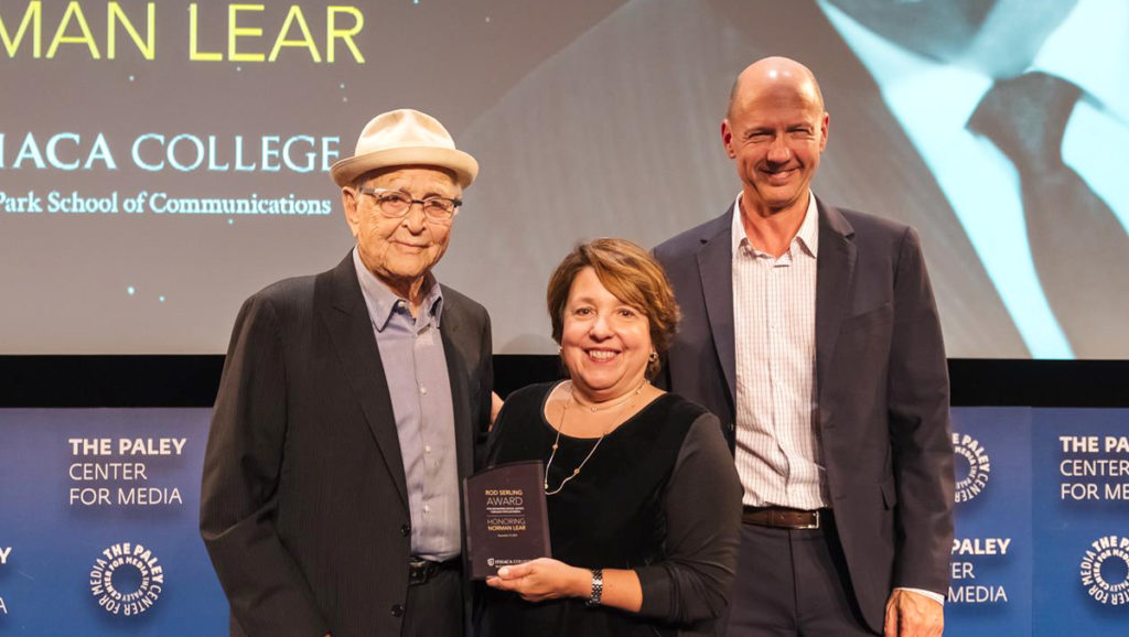 From left, award winner Norman Lear; Diane Gayeski, dean of the Roy H. Park School of Communications; and Lears colleague Mike Royce, 86, stand with the 2018 Serling Award.