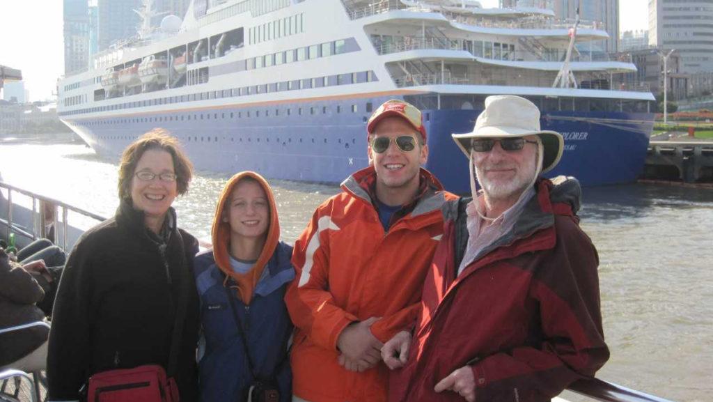 Ithaca College professor Frederik Kaufman taught for Semester at Sea. From left, his wife Donna Fleming, children Amelia and Aaron Kaufman, and Frederick Kaufman stand in front of the programs docked cruise ship.