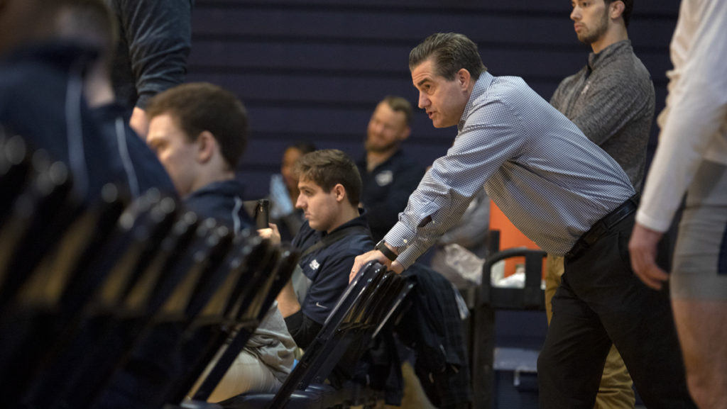 Wrestling head coach Marty Nichols observes his team during a match against Wilkes University on Feb. 8. Nichols was a three-time All-American at Ithaca College and graduated in 1990.