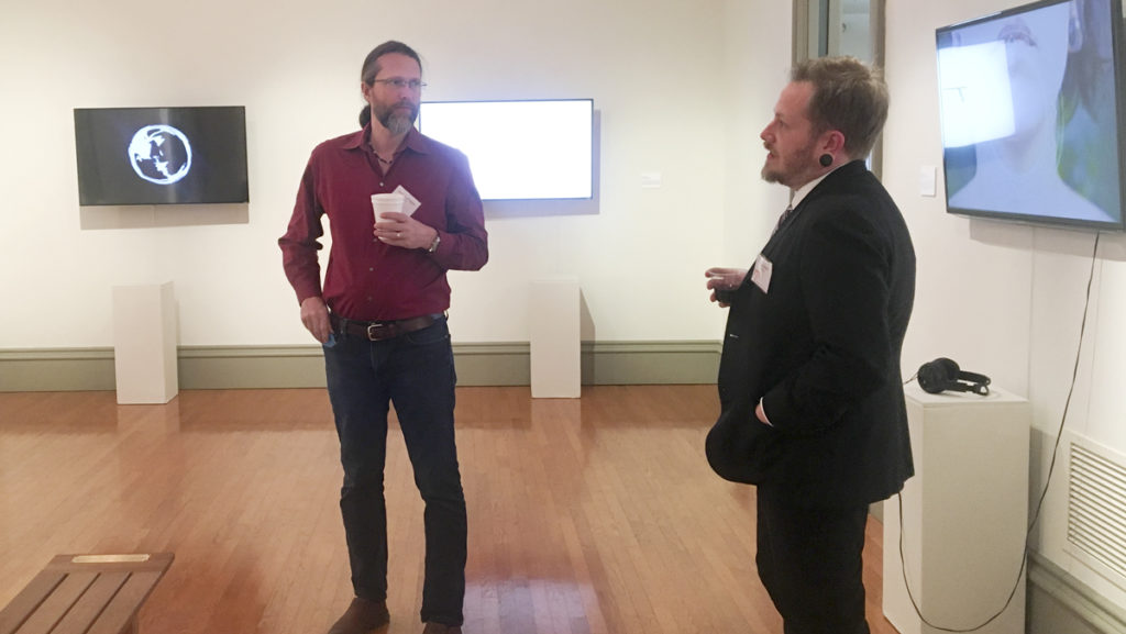 From left, Jason Harrington and Brad Lewter, associate and assistant professors in the Department of Media Arts, Sciences and Studies, present their duo exhibition “Symbol/Symmetry” on Jan. 25.