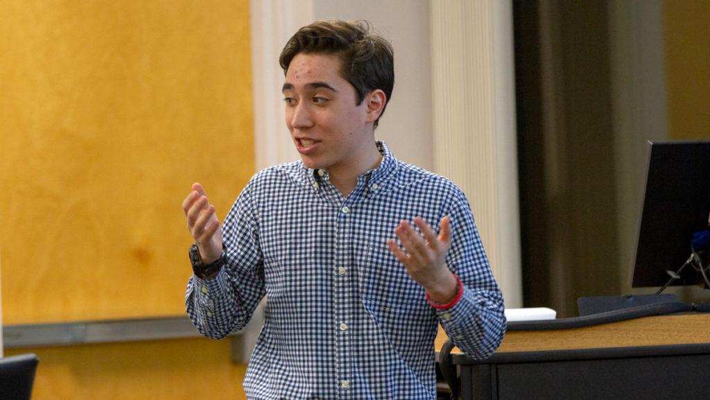 Sophomore senator-at-large Elijah Nishiura presents the Civic Engagement Bill to the SGC during its Feb. 25 meeting. The bill requires the SGC to purchase 400 stamps to provide to students for free during election cycles.  