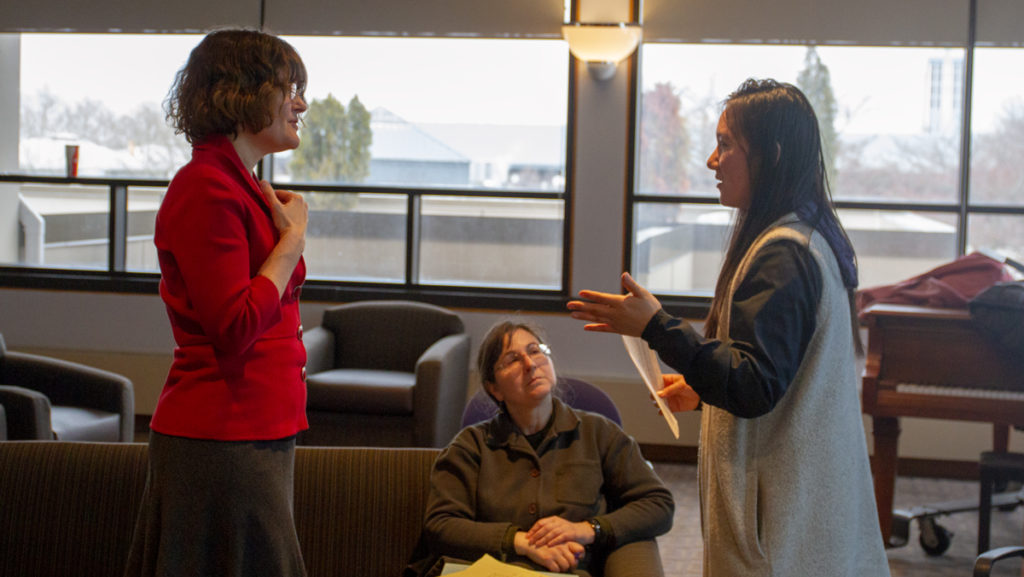 From left, Bonnie Prunty, dean of students in the Department of Student Affairs and Campus Life, Communications librarian Cathy Michael and senior Subin Lee discuss strategic planning themes.