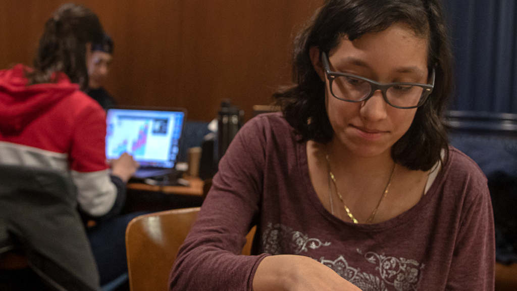 Freshman Helen Reyes plays bingo at the Campus Center Bingo Night  on March 18. The event is new and will take place every Monday for the rest of the semester. The event series will feature prizes including cash, gift cards and more. 