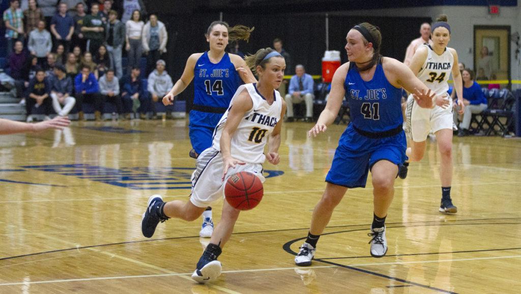 Senior guard Annie Giannone dribbles past Saint Josephs senior forward Emily Benway. Giannone contributed 22 points to the Bombers 74–63 defeat of the Monks.