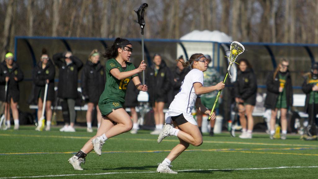 Sophomore attacker Jacqui Hallack charges up the field past Brockport freshman midfielder Julie Carballo.