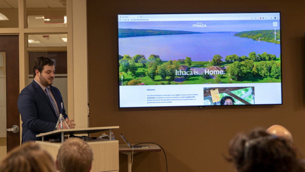 Dominick Recckio ’16, director of strategic communications and partnerships at the Tompkins County Chamber of Commerce, gives a presentation about Live in Ithaca, an initiative that aims to to recruit and retain a diverse local workforce.