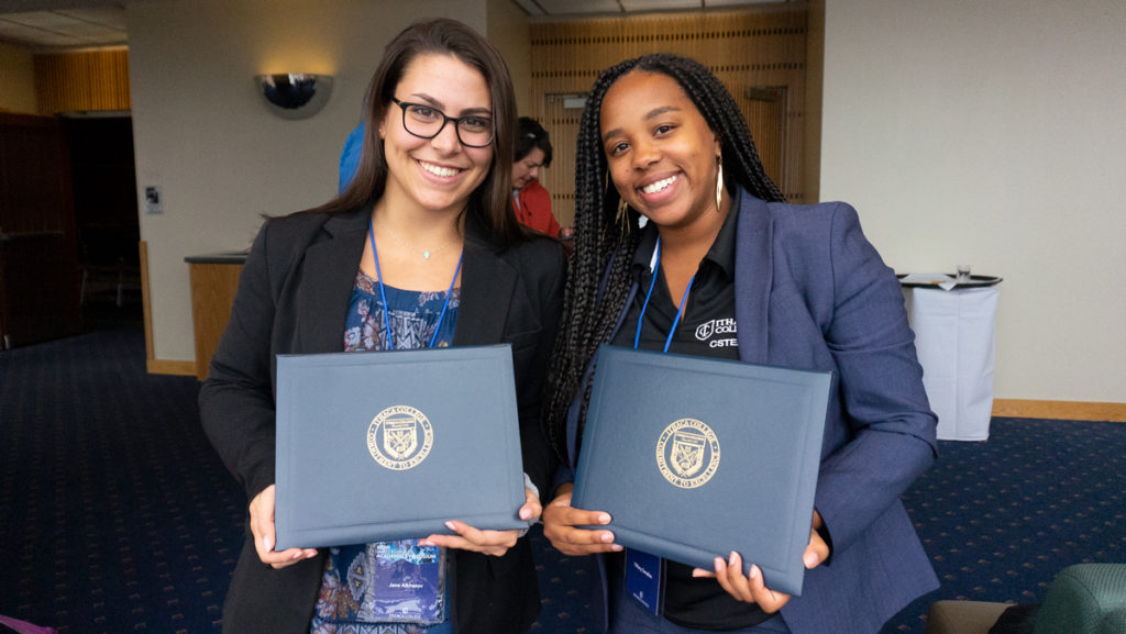 From left, seniors Jane Alkhazov and Tiffany Sanabia, hold the awards they received at the 22nd Annual James J. Whalen Academic Symposium held in Campus Center on April 2.