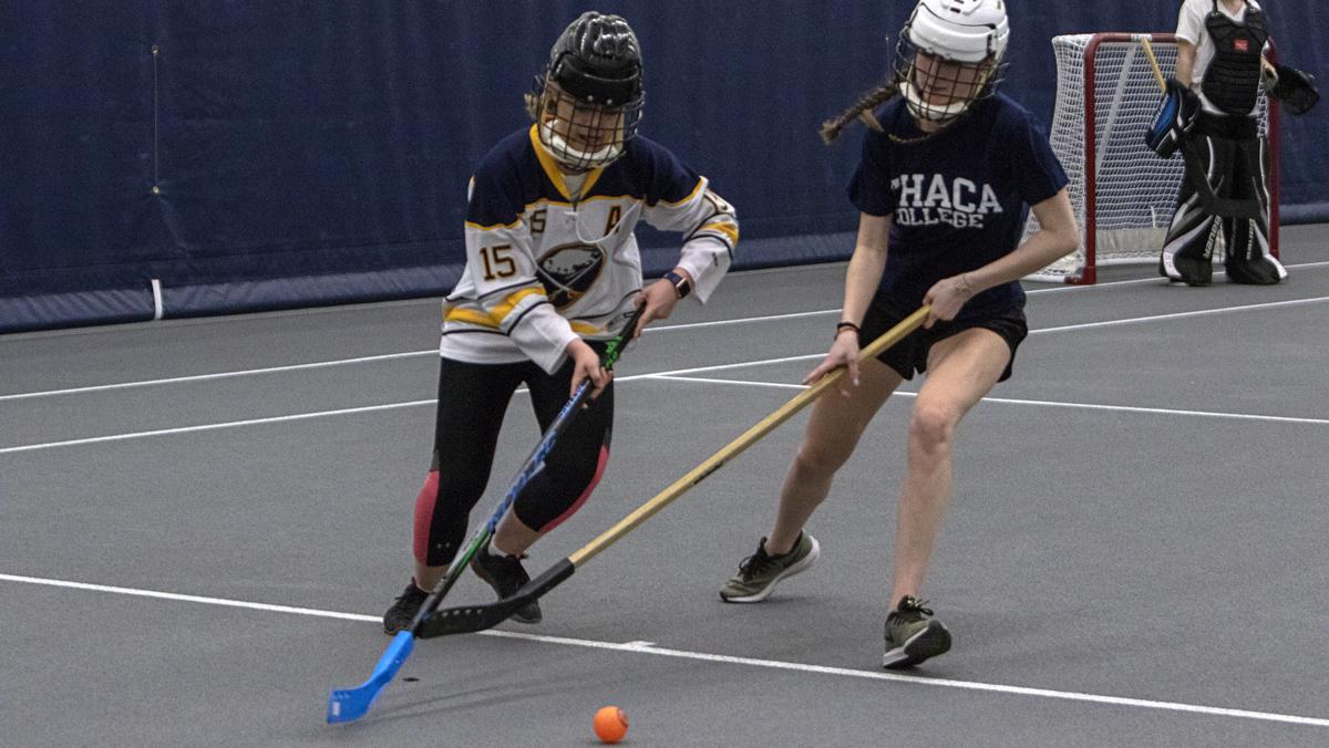 Students take a slap at playing intramural floor hockey