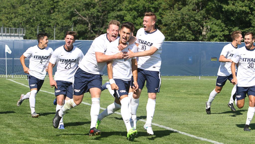 Senior defender Justinian Michaels celebrates with his team after scoring the first goal of the game against New York University on Aug. 30. Michaels spoke at the ceremony before the game honoring Jase Barrack, a club soccer player who died suddenly in May.