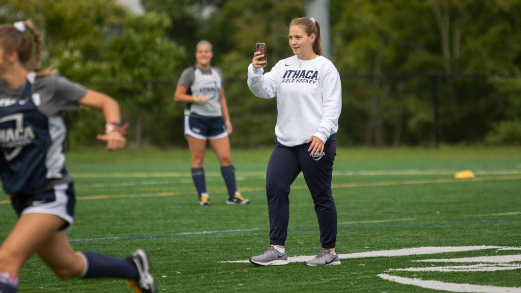Senior Marissa Harris takes video for an Instagram story during the field hockey teams practice Sept. 15 in Higgins Stadium. Harris, a former member of the team, has been running its social media since 2018.