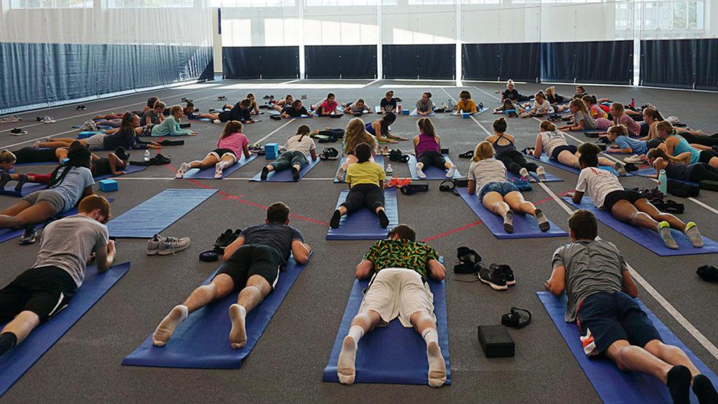 Athletes from the Ithaca College mens and womens track and field teams participate in a yoga session with instructor Melissa Weiner on Sept. 10.