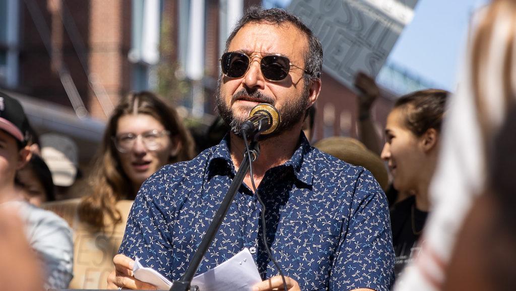Luca Maurer, director of the Center for LGBTQ Outreach, Education and Services, speaks at the Ithaca Global Climate Strike on Sept. 20, 2019. He writes that LGBTQ history education is vital.