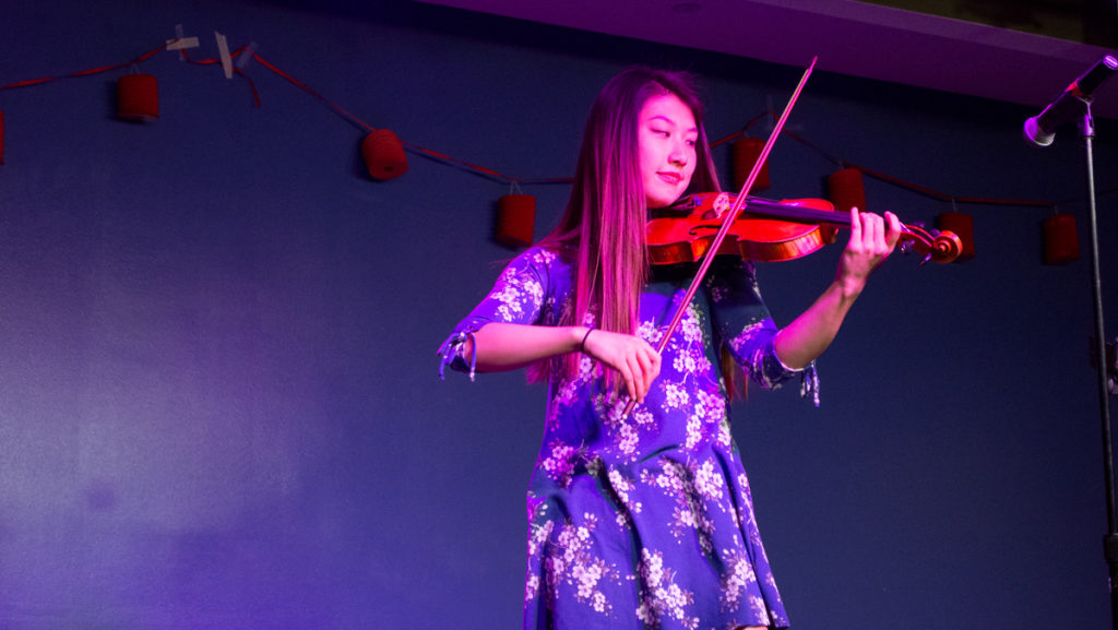 Freshman+Jingwen+Ou+performs+%E2%80%9CButterfly+Lovers%E2%80%9D+on+violin+at+the+Mid-Autumn+Festival+on+Oct.+4.+The+festival+was+hosted+by+the+Chinese+Students+and+Scholars+Association.