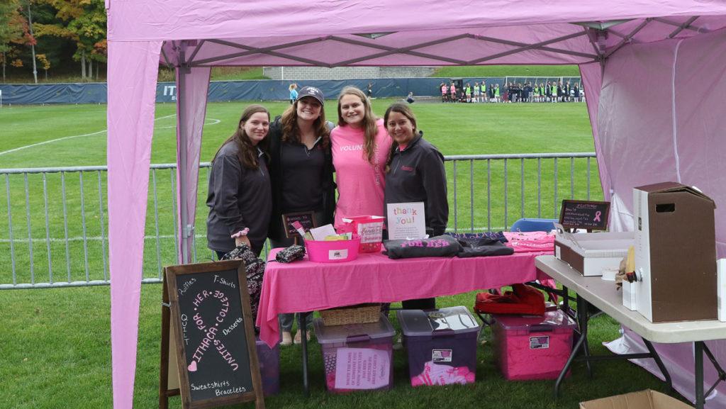 Members of the Ithaca College chapter of Unite for HER table at the womens soccer teams Pink game to raise funds and awareness for breast cancer Oct. 12 at Carp Wood Field