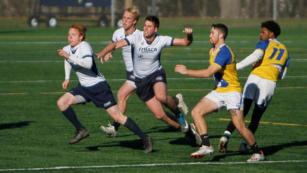 From left, juniors Will Blum and Steffen Nobles and senior Brendan O’Grady run past a pair of opponent during a game against Hofstra University on Nov. 16.