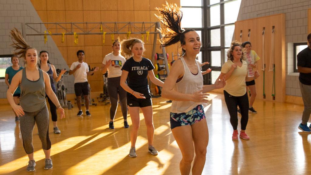 Melissa Patnella 19 teaches a Zumba class in the Fitness Center Aerobics Room during Spring 2019.