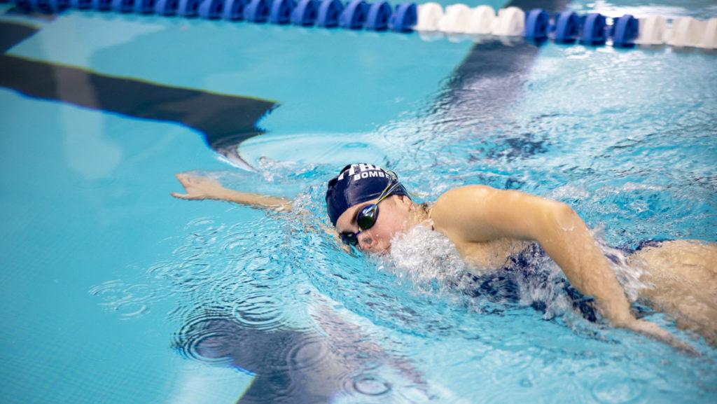 Freshman swimmer Jane Pfeufer has hip impingement and knee tendonitis that cause her regular pain. Despite the injuries, she is one of the fastest  swimmers on the team.