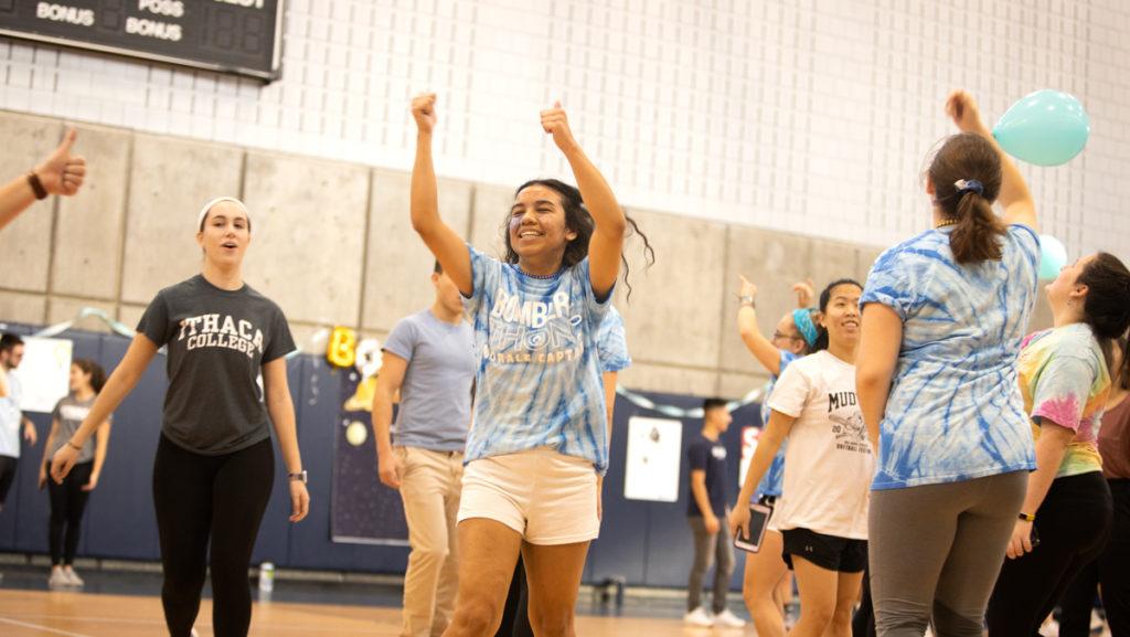 From left, junior Ellie McNally and sophomore Ruth Hernandez dance in the BomberTHON to raise money for Upstate Golisano Childrens Hospital in Syracuse on Dec. 7, 2019.
