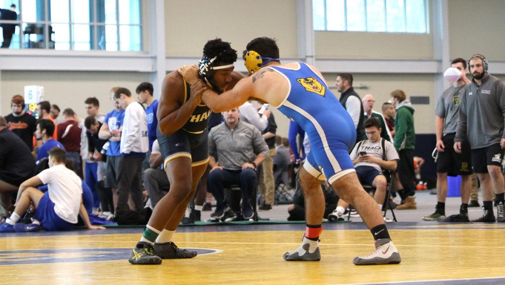 Sophomore Eze Chuckwuezi wrestles a Western New England University competitor at the 35th Ithaca College Invitational Nov. 2. in Glazer Arena.