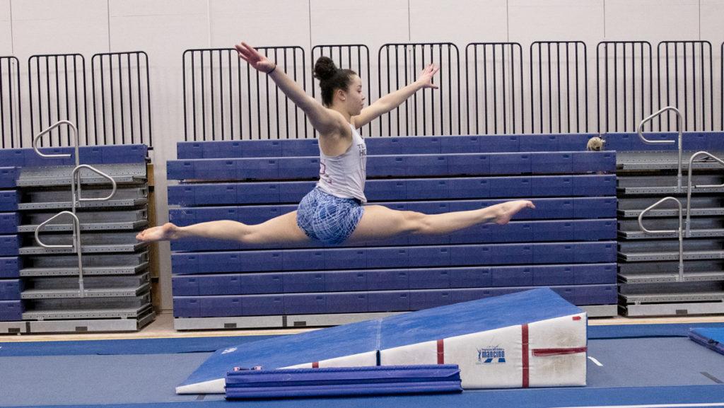 Freshman gymnast Cameryn Nichols performs a split leap during practice in Ben Light Gymnasium. Nichols is the first all-around competitor at the college since 2016.